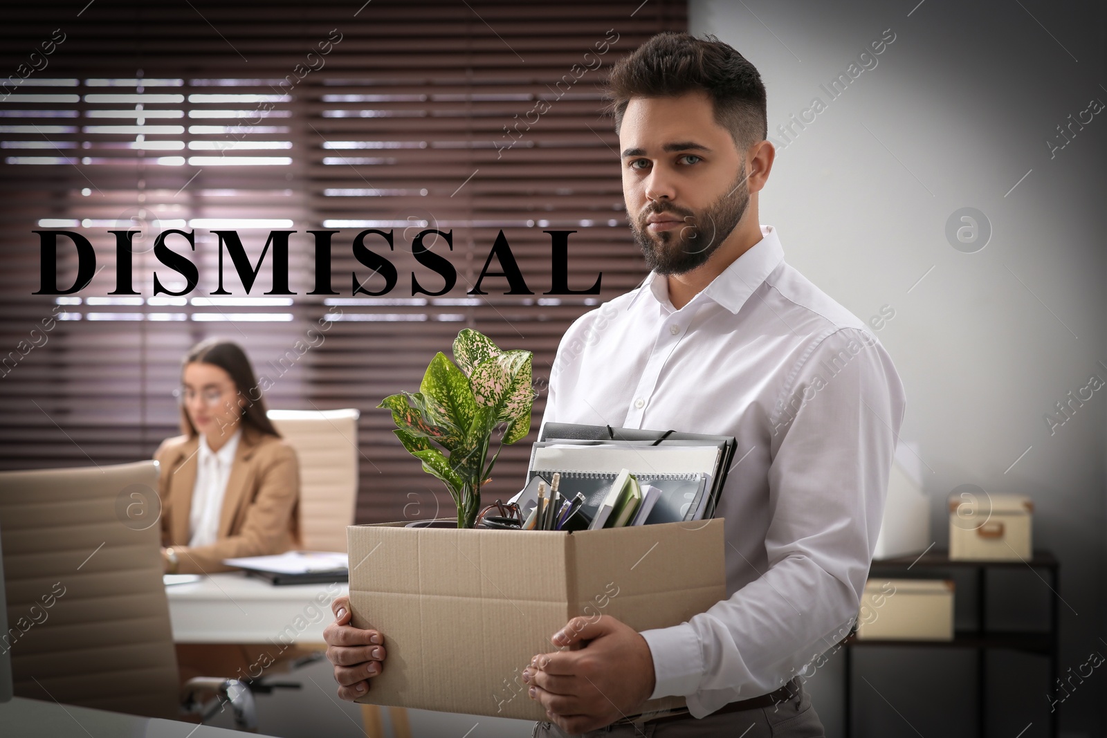 Image of Upset dismissed man carrying box with personal stuff in office