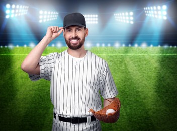 Image of Professional baseball player with glove and ball on stadium