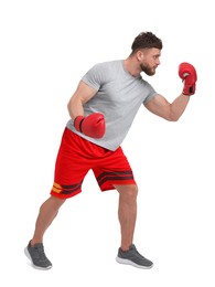 Photo of Man in boxing gloves fighting on white background