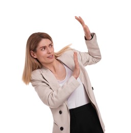 Scared businesswoman avoiding something on white background