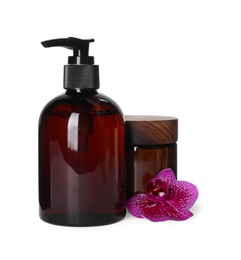 Photo of Bottle and jar of shampoo on white background