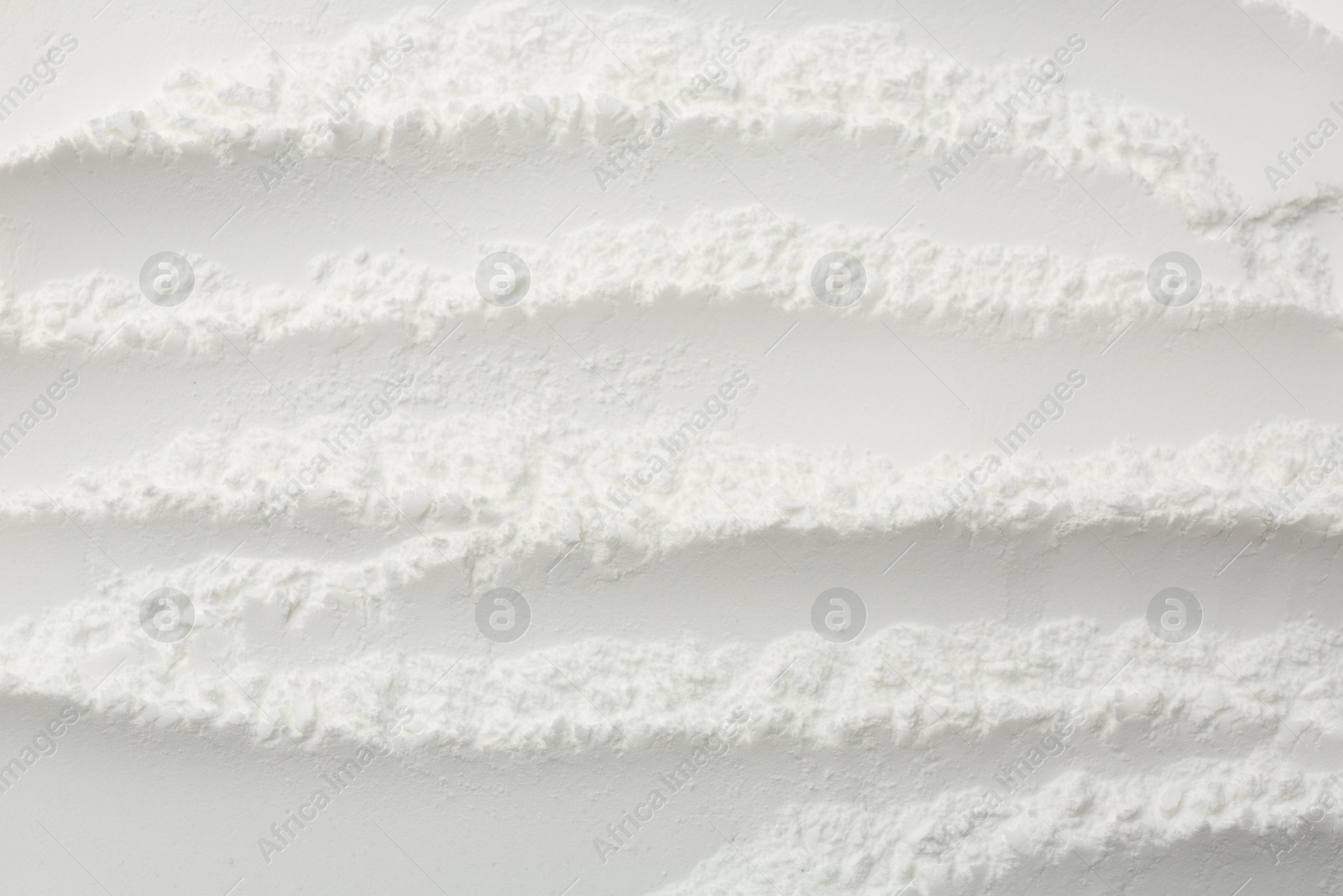 Photo of Texture of baking powder as background, top view