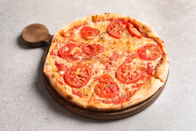 Photo of Hot cheese pizza Margherita on grey table