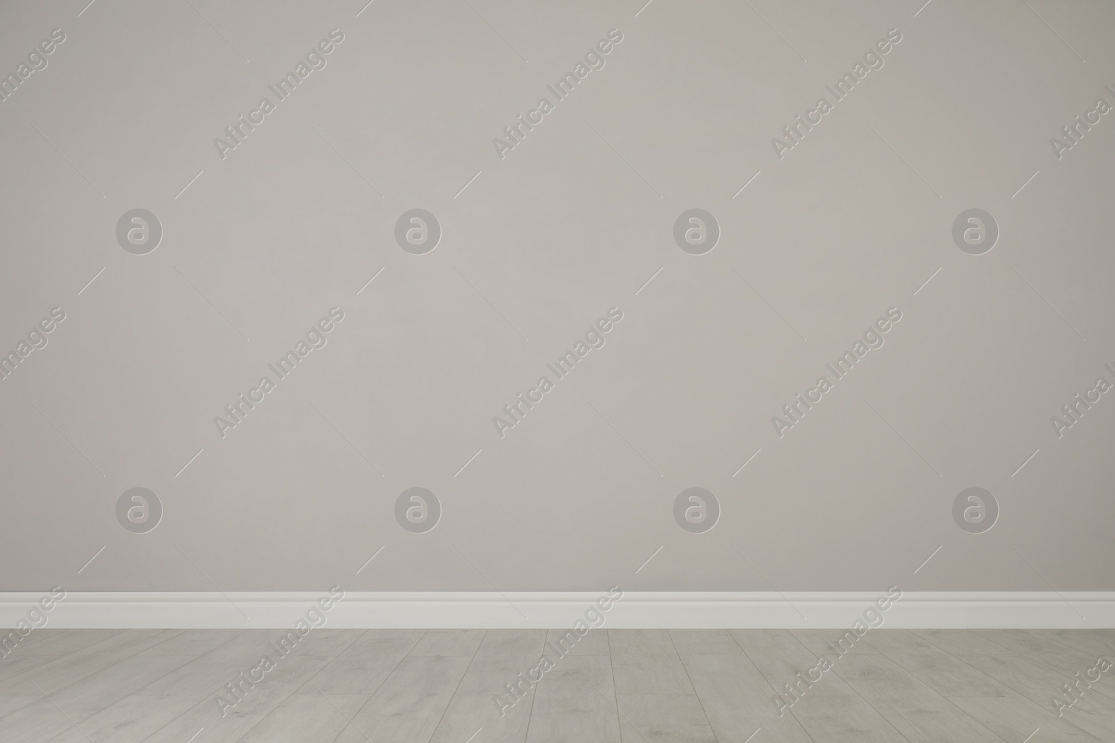 Photo of Blank light grey wall in room. Space for design