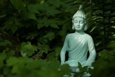 Photo of Decorative Buddha statue outdoors. Space for text
