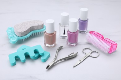 Photo of Set of pedicure tools on white table