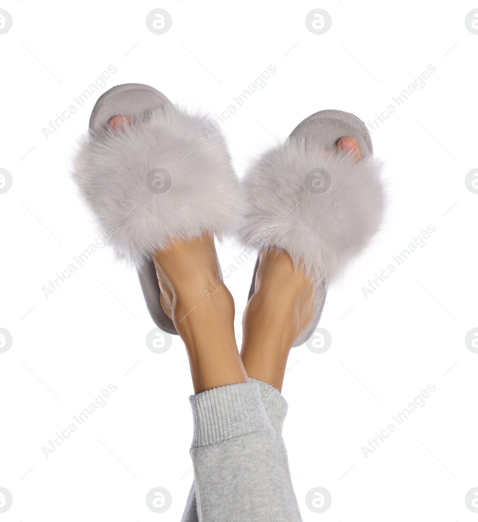 Photo of Woman in fluffy slippers on white background, closeup