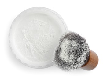 Photo of Rice face powder and brush isolated on white, top view. Natural cosmetic