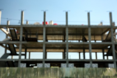 Blurred view of unfinished building against blue sky