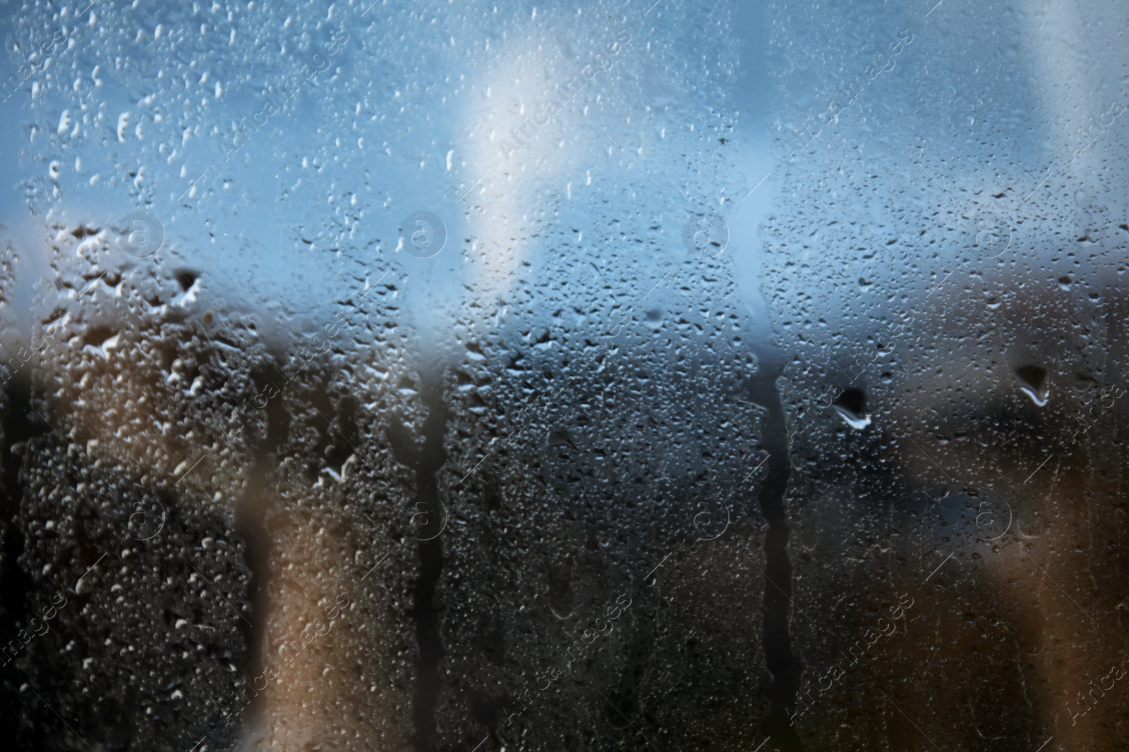 Photo of Rain drops on window glass as background