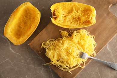 Photo of Flat lay composition with cooked spaghetti squash on table
