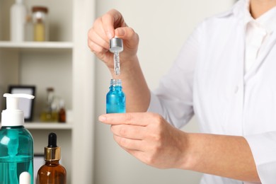 Photo of Dermatologist developing cosmetic product in laboratory, closeup