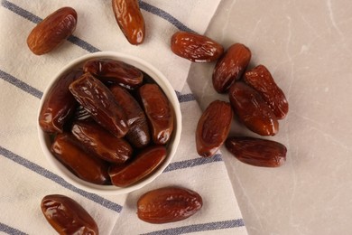Photo of Tasty sweet dried dates on light grey table, flat lay