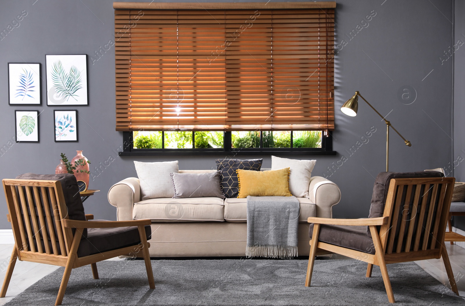 Photo of Stylish living room interior with comfortable sofa and armchairs