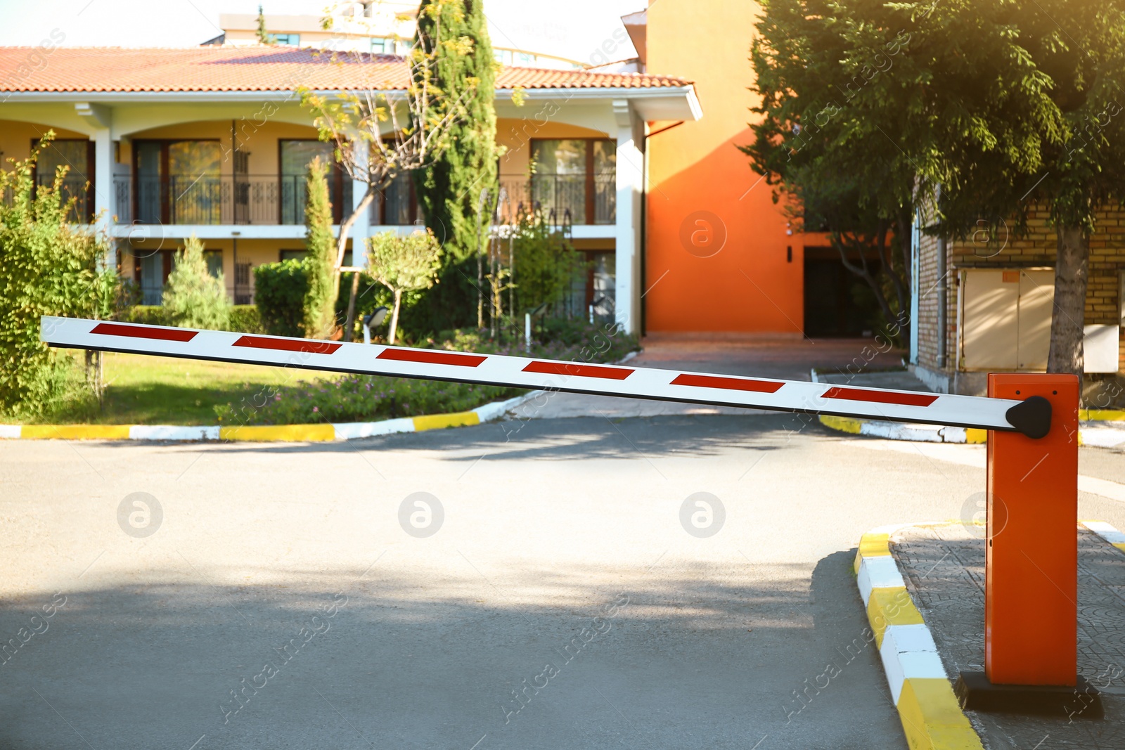 Photo of Automatic boom barrier on sunny day outdoors