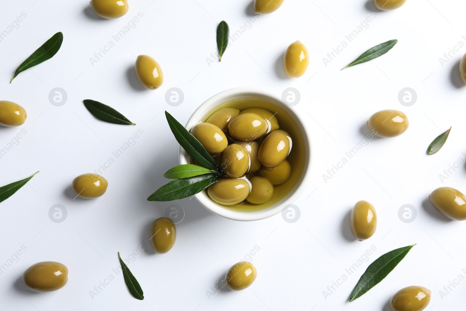 Photo of Flat lay composition with fresh olives in oil on white background