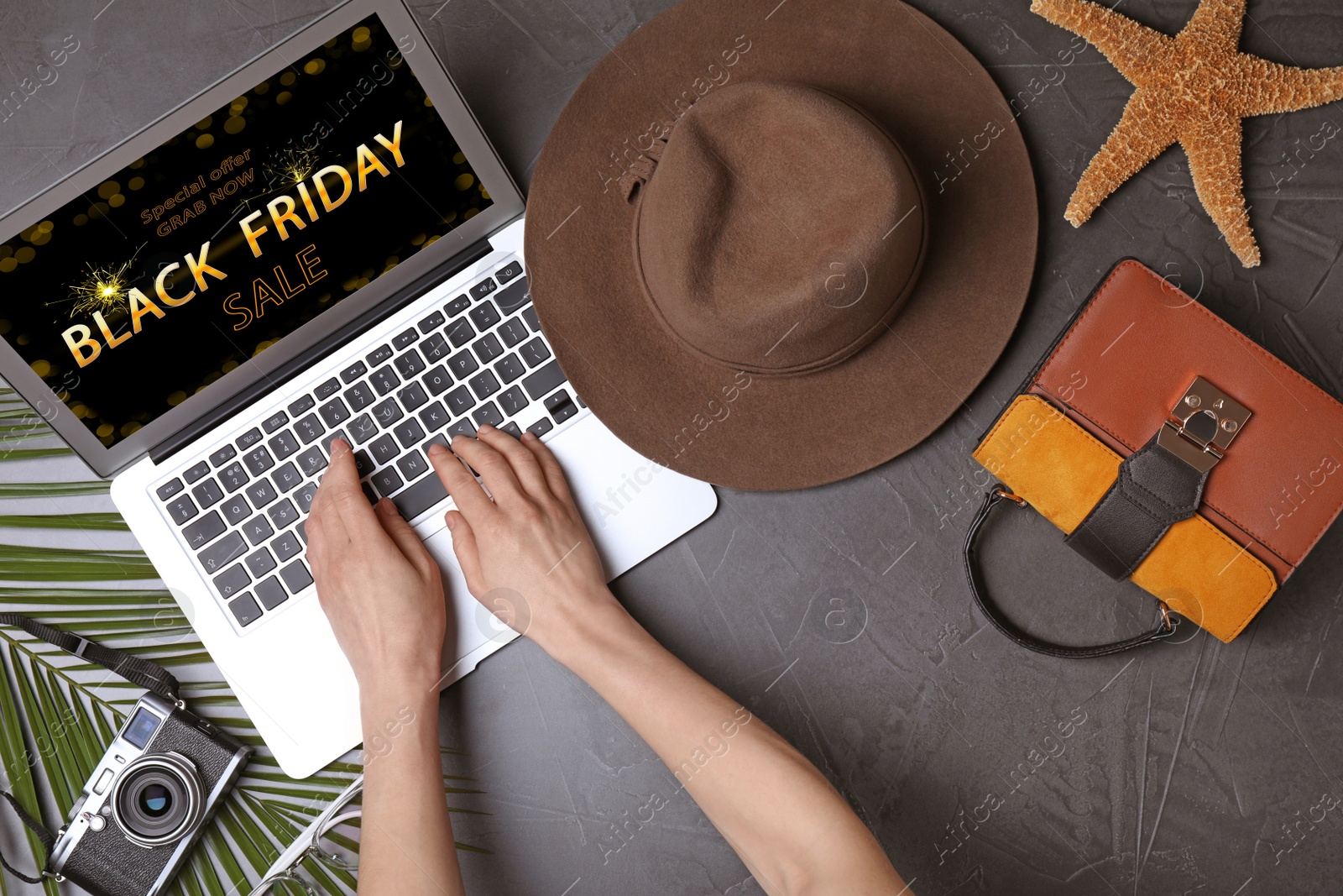 Image of Black Friday. Woman shopping online using laptop, top view