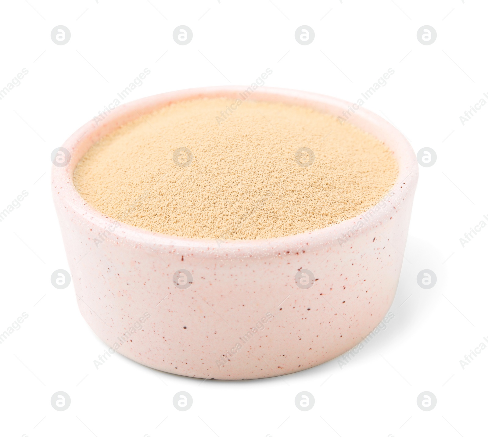 Photo of Granulated yeast in bowl isolated on white
