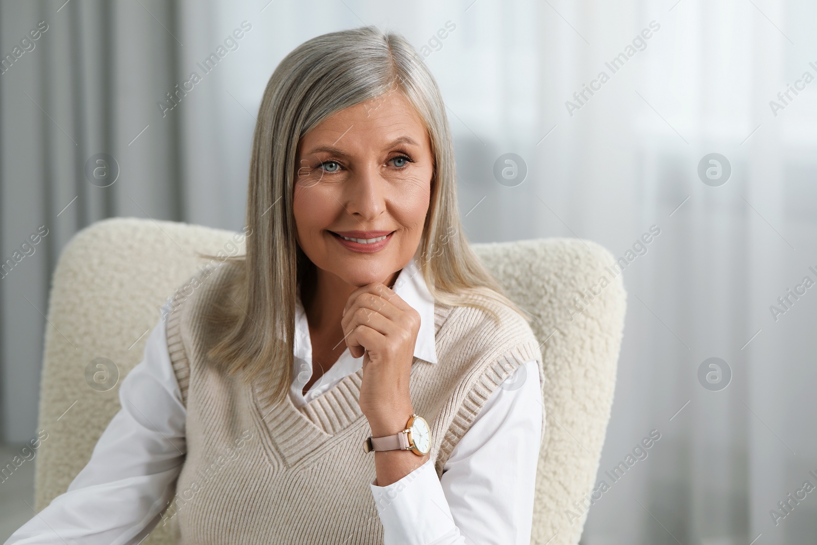 Photo of Portrait of beautiful middle aged woman indoors, space for text