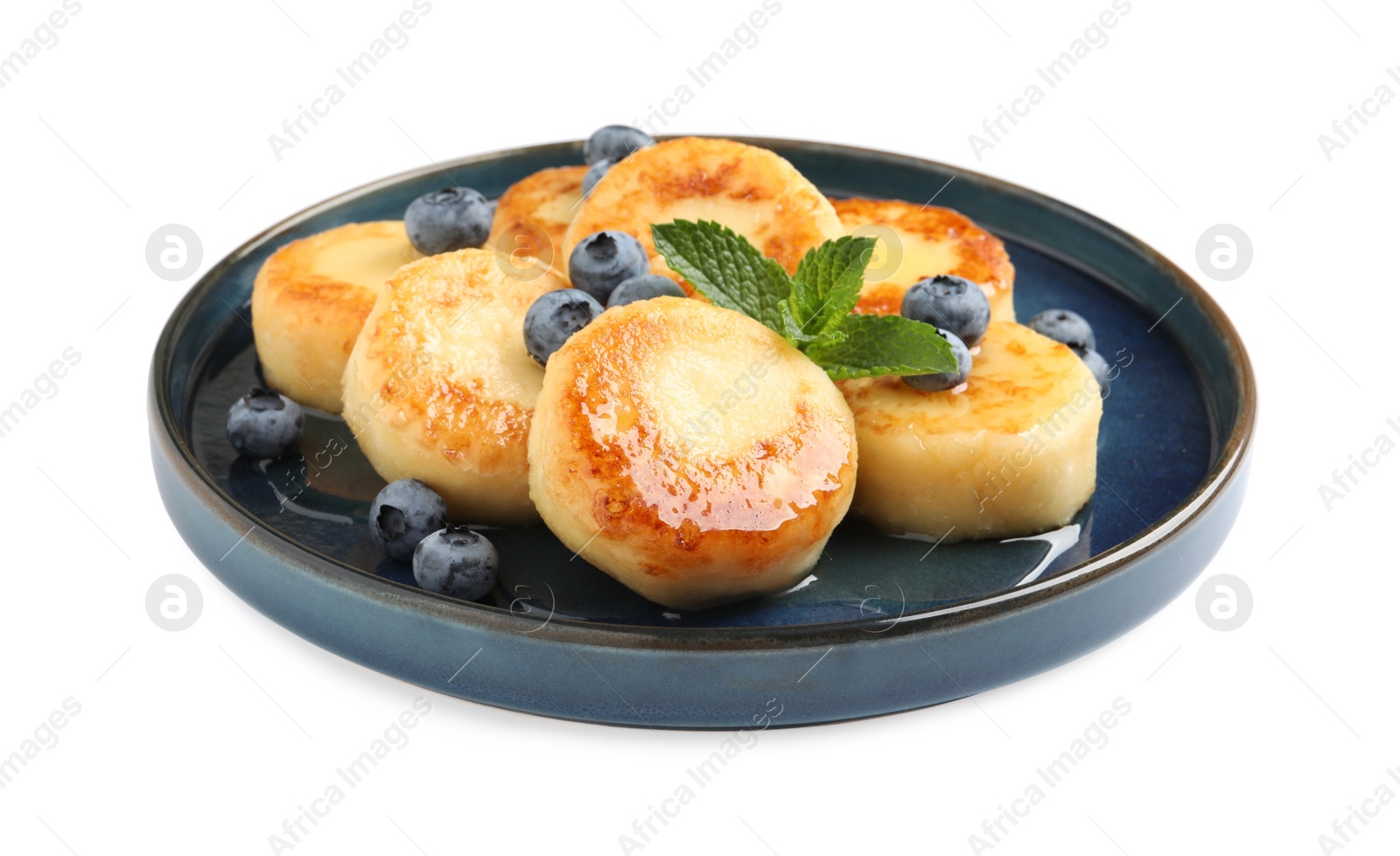 Photo of Delicious cottage cheese pancakes with blueberries on white background