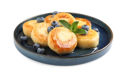 Delicious cottage cheese pancakes with blueberries on white background