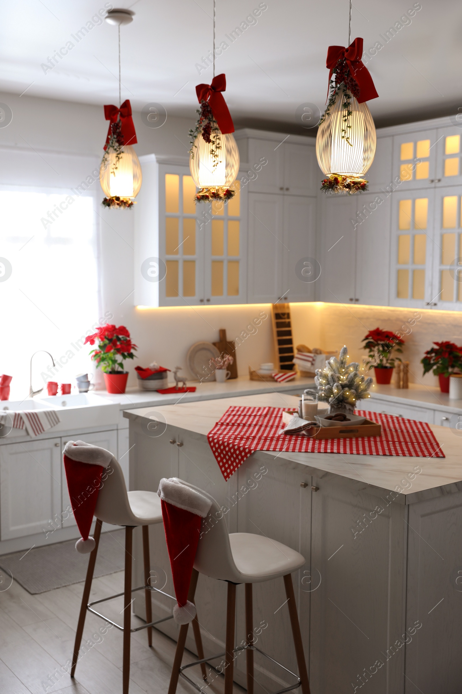 Photo of Stylish kitchen interior with beautiful Christmas decor