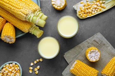 Photo of Flat lay composition with corn milk and cobs on grey table