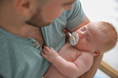 Father with his newborn son, closeup view