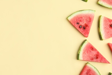 Photo of Slices of ripe watermelon on beige background, flat lay. Space for text