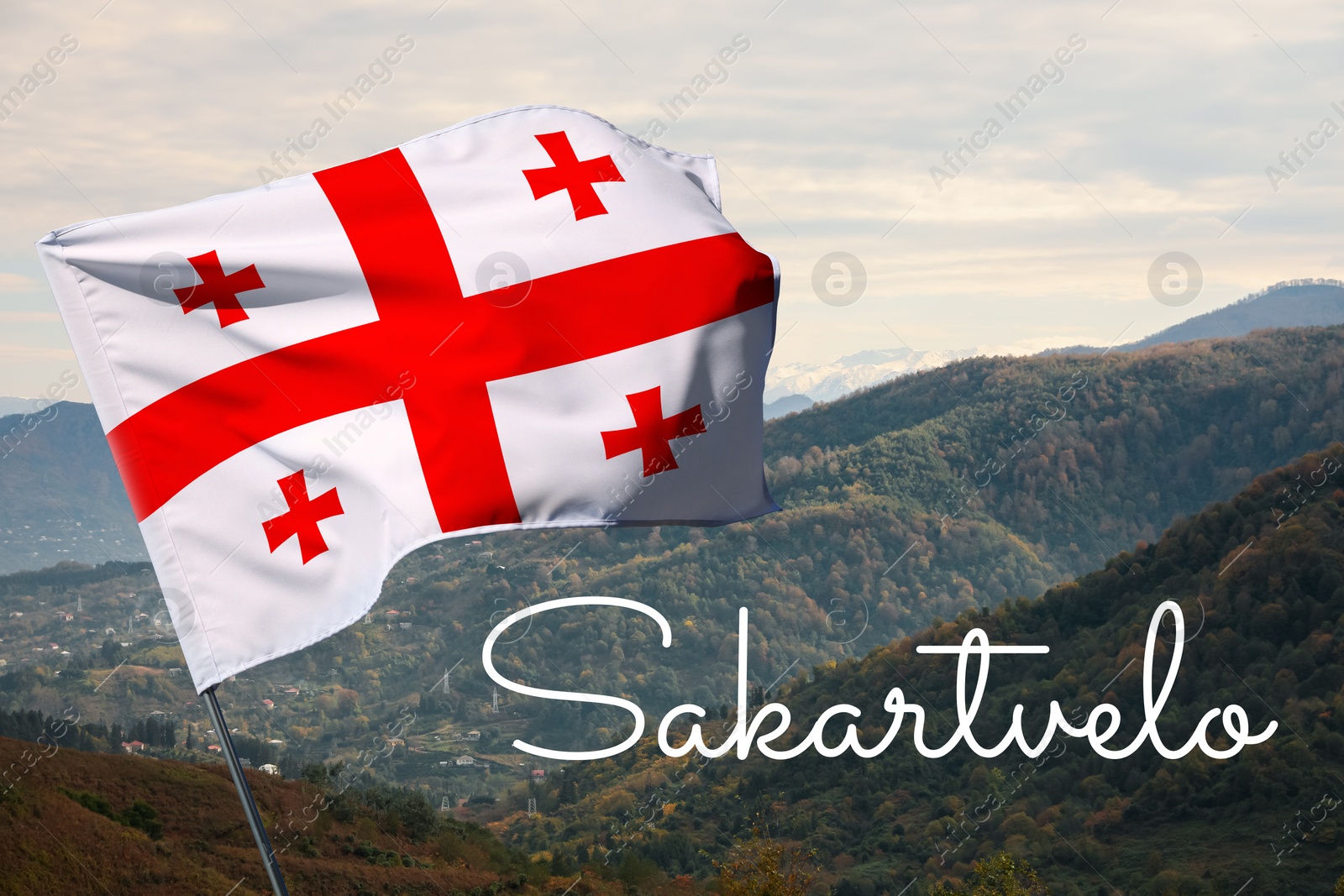 Image of Word Sakartvelo meaning native name of Georgia near its national flag against beautiful mountain landscape