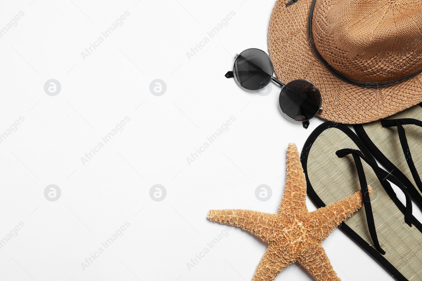 Photo of Flat lay composition with stylish beach accessories on white background