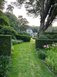 Photo of Netherlands, Amsterdam - July 19, 2022: Luxury hotel Het Roode Koper in beautiful green forest