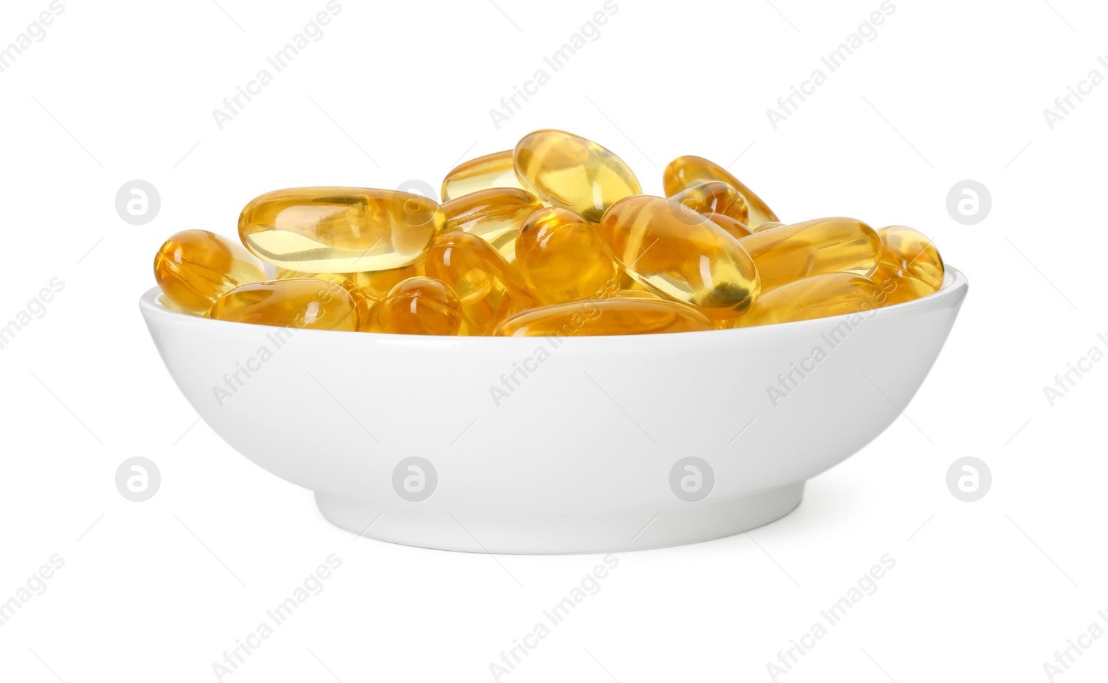 Photo of Vitamin capsules in bowl isolated on white. Health supplement