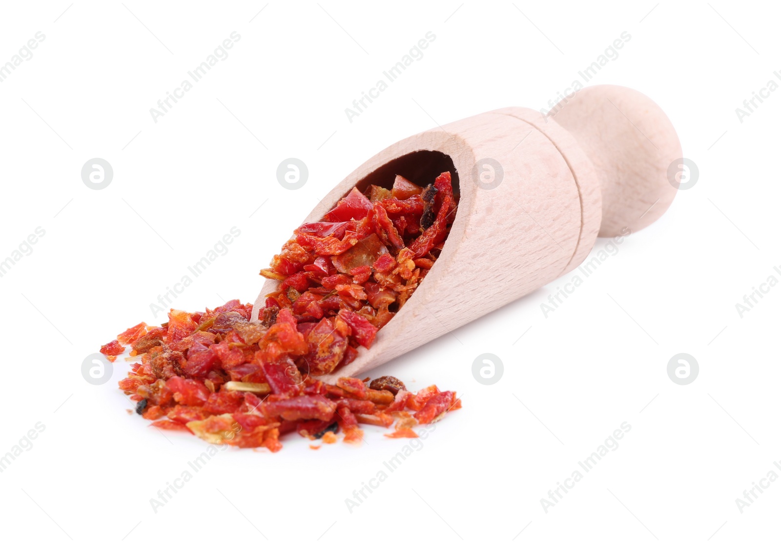 Photo of Aromatic spice. Red chili pepper flakes in scoop isolated on white