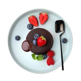 Plate with delicious chocolate fondant, berries and mint isolated on white, top view