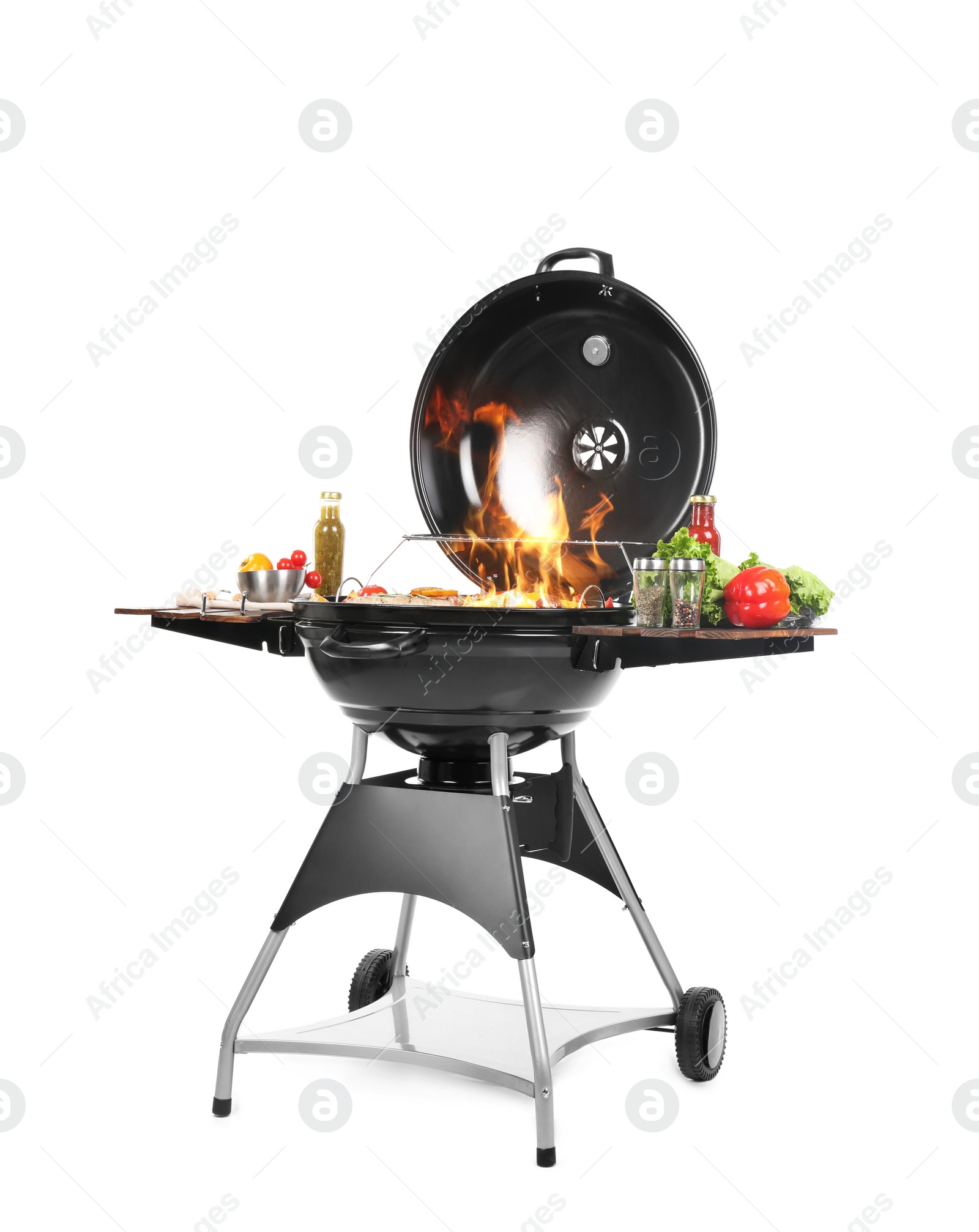 Image of Flaming barbecue grill with cooking meal on white background