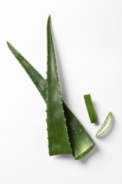 Photo of Cut aloe vera plant on white background, flat lay