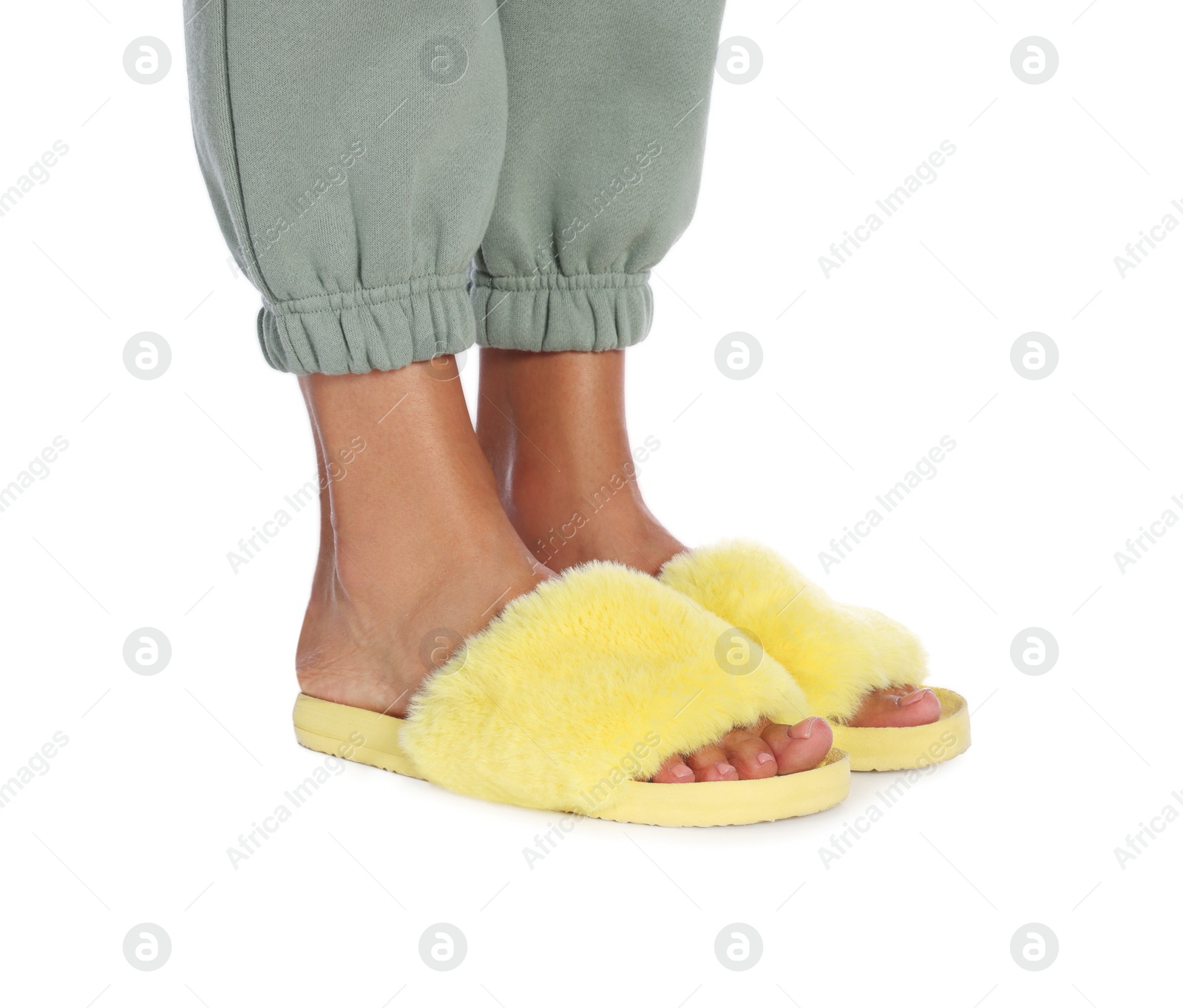 Photo of Woman in fluffy slippers on white background, closeup