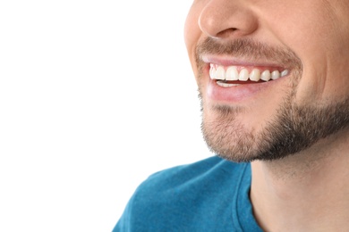 Smiling man with perfect teeth on white background, closeup