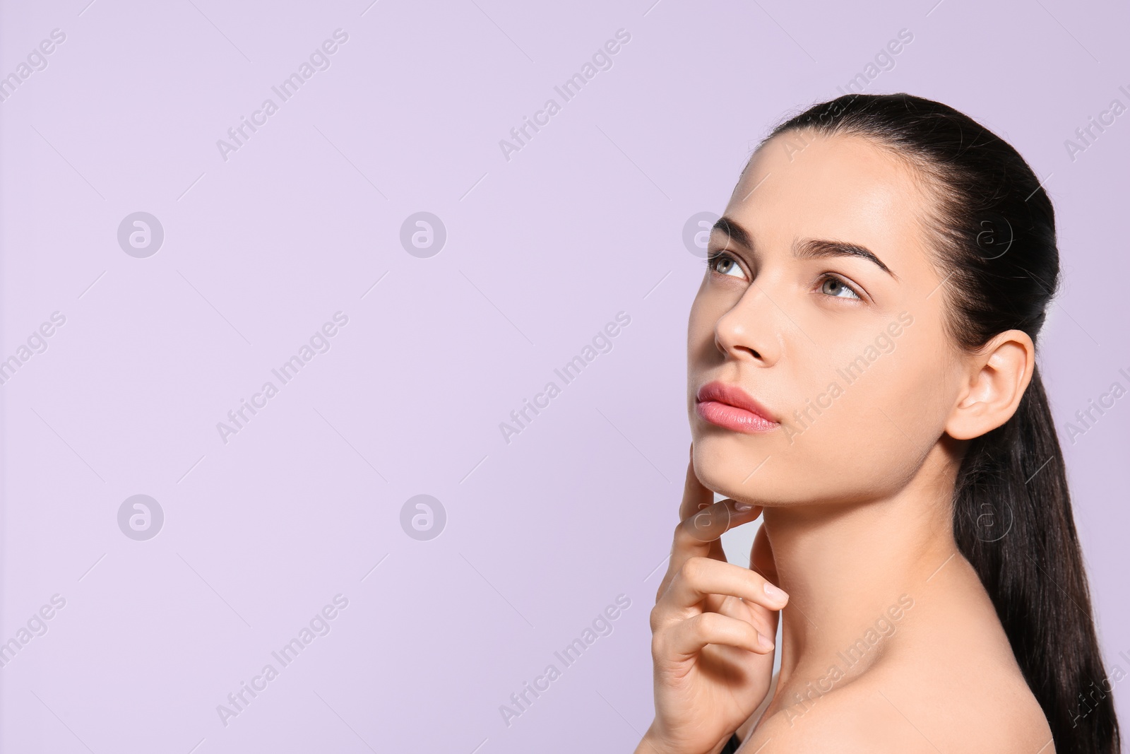 Photo of Beautiful woman with perfect eyebrows on light background