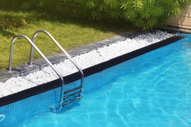 Photo of Modern swimming pool with stairs at resort