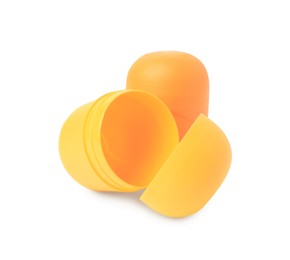 Photo of Slynchev Bryag, Bulgaria - May 23, 2023: Yellow plastic capsules from Kinder Surprise Eggs on white background