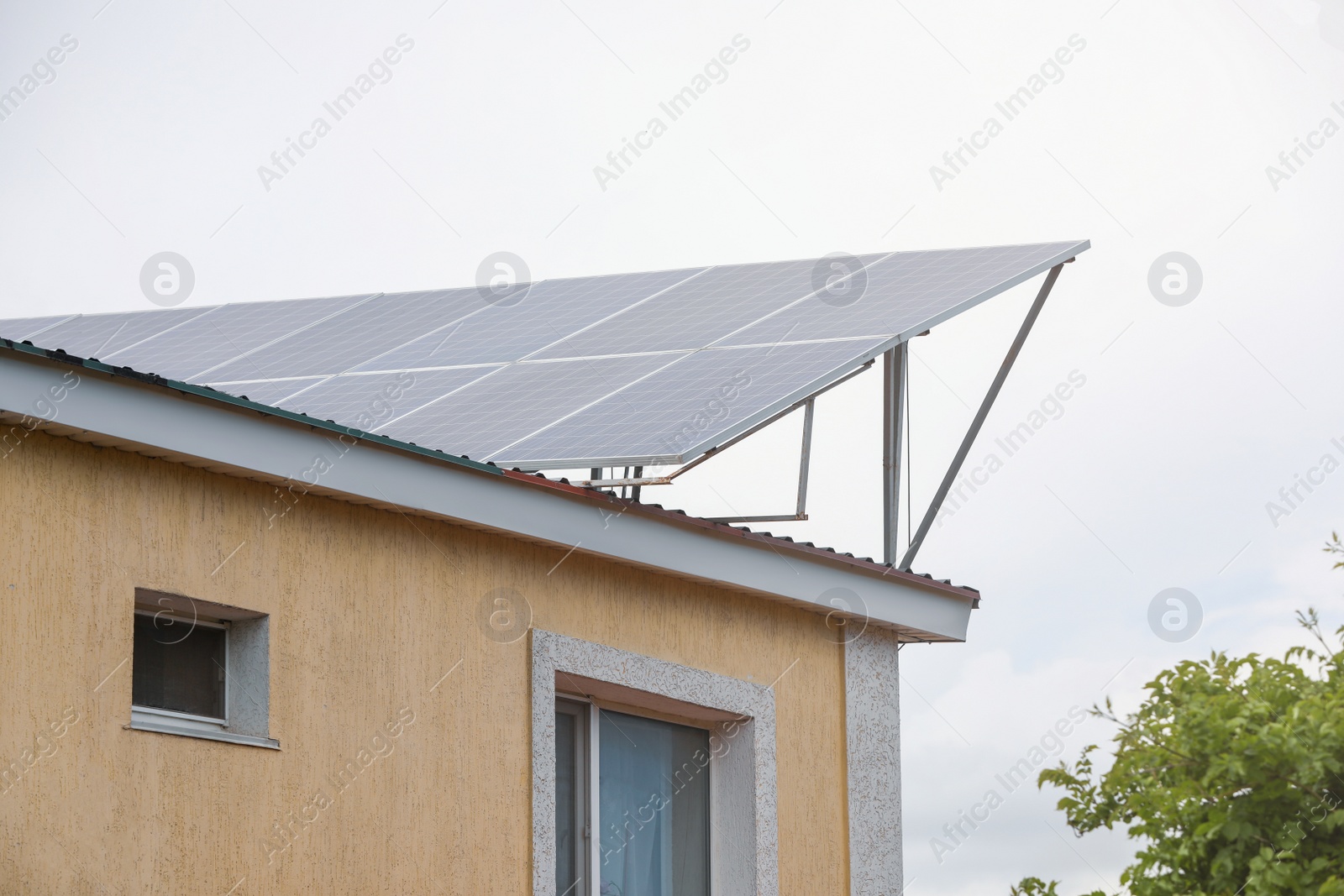 Photo of House with installed solar panels on roof