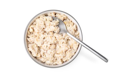 Photo of Ceramic bowl and spoon with oatmeal isolated on white, top view