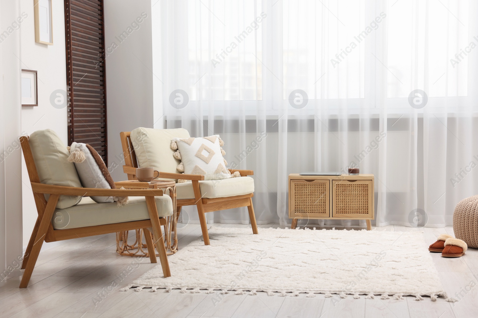 Photo of Stylish living room with soft white carpet and furniture. Interior design