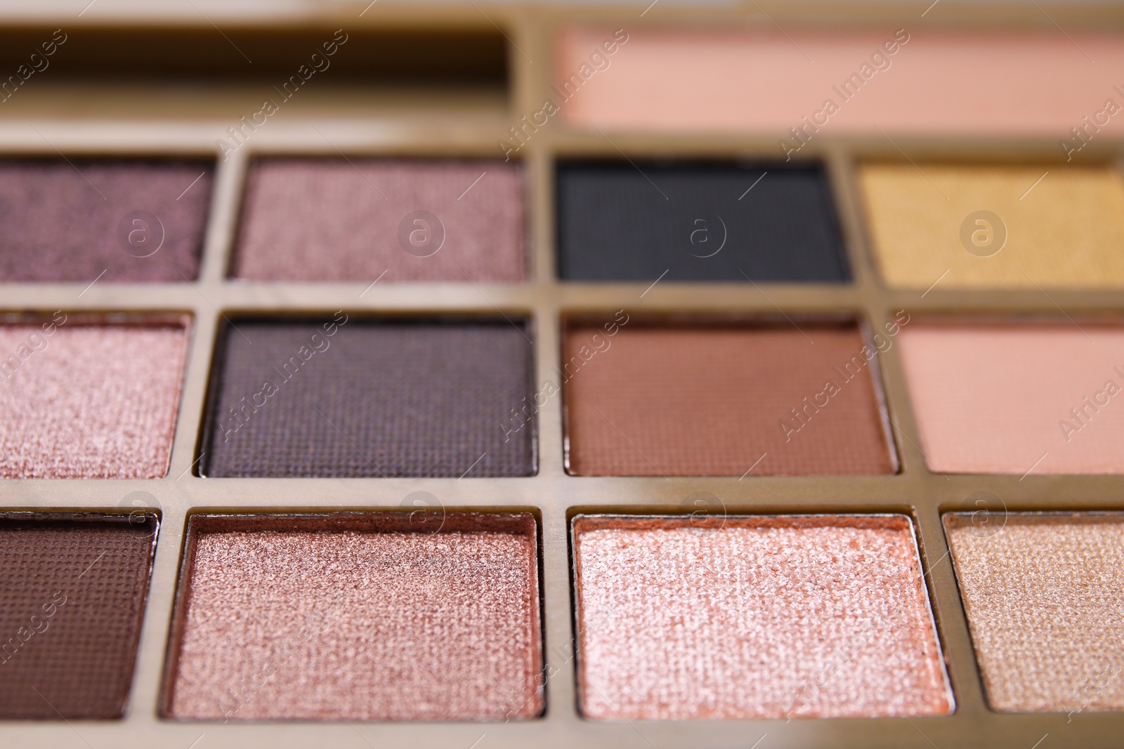 Photo of Beautiful eyeshadow palette as background, closeup. Professional cosmetic product