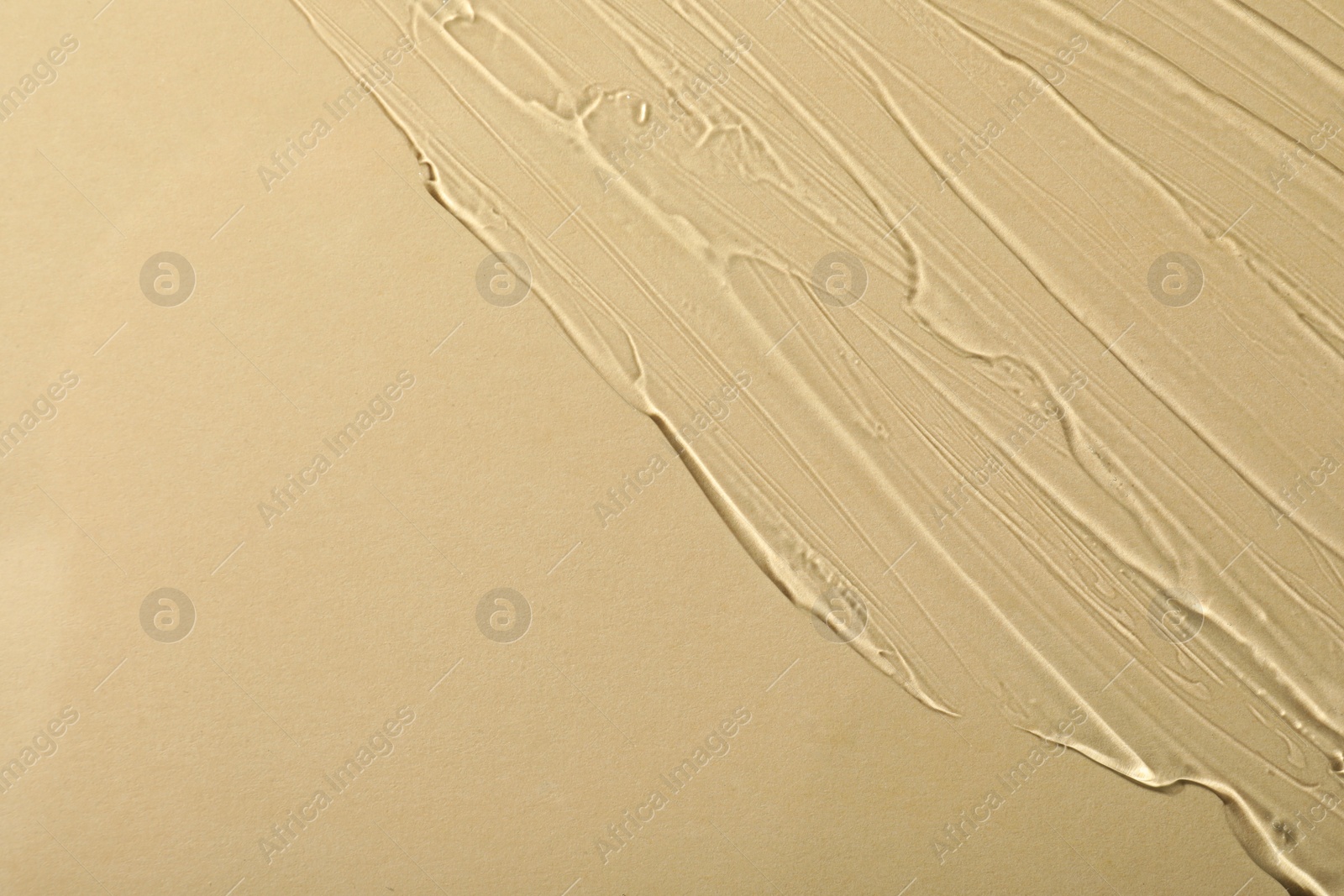 Photo of Transparent cosmetic gel on beige background, space for text