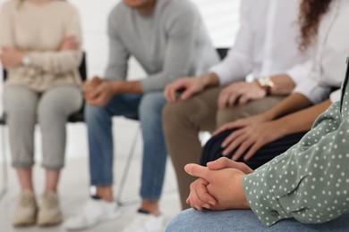 Photo of People at group therapy session indoors, closeup