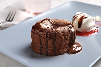 Photo of Delicious fresh fondant with hot chocolate and ice cream served on plate. Lava cake recipe