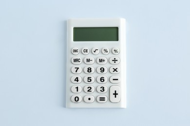 Photo of Modern calculator on white background, top view